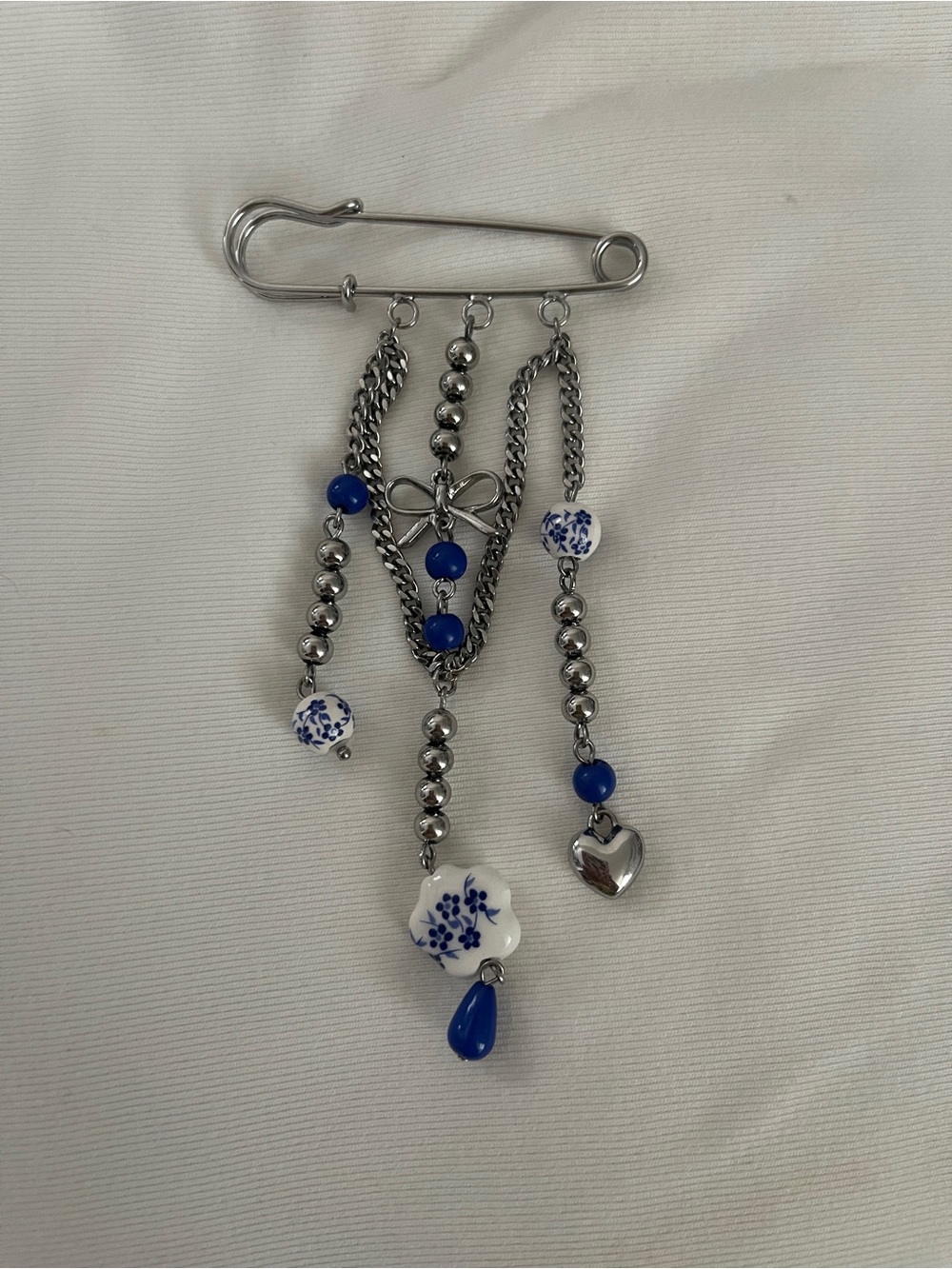Piper K Silver and Blue Dangle Safety-Pin Brooch with Ceramic Flower Charm